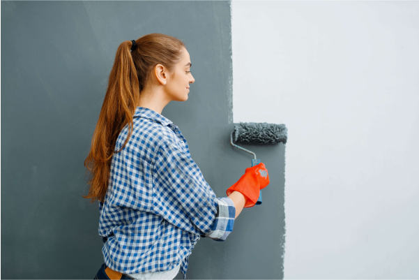 cheerful female house painter paints walls indoor 2021 08 27 09 37 21 utc